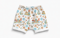 Children's shorts with a nautical pattern featuring boats, seagulls, and lighthouses on a white background.