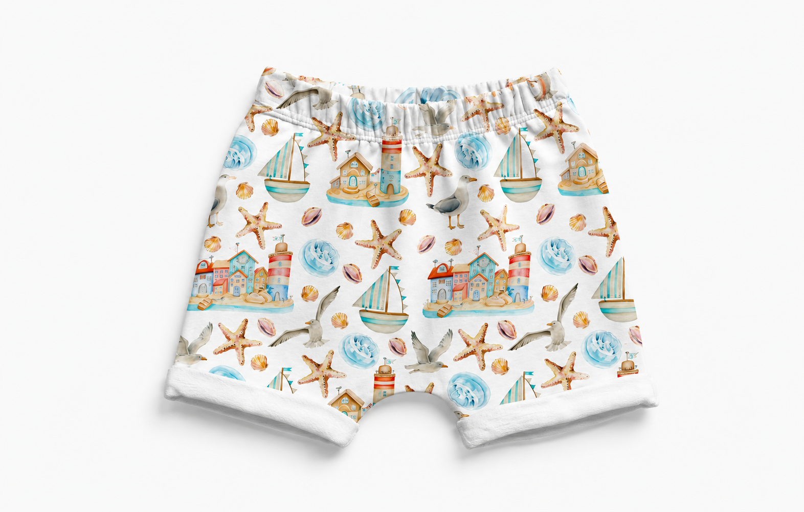 Children's shorts with a nautical pattern featuring boats, seagulls, and lighthouses on a white background.